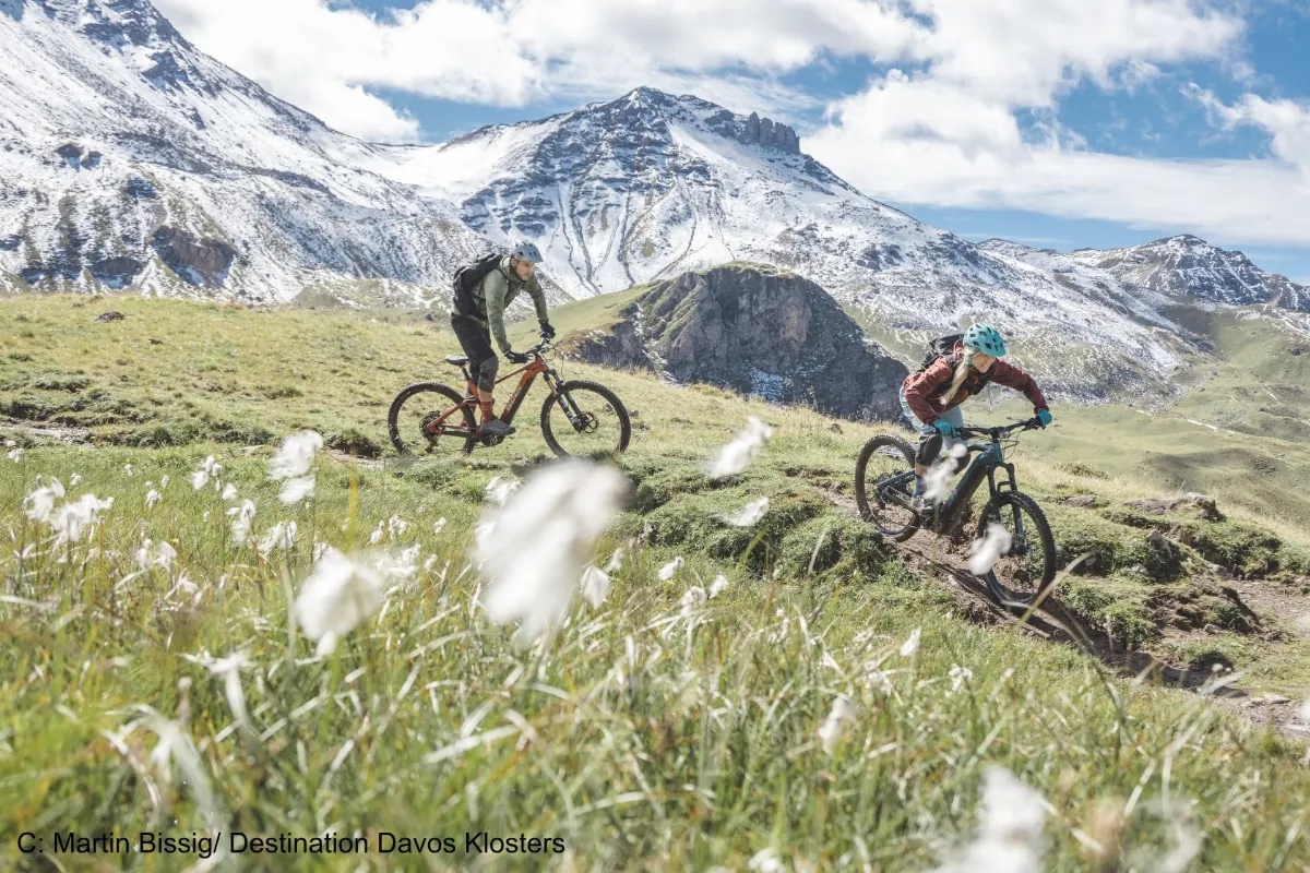 Mountain bikers riding in the Swiss Alps
