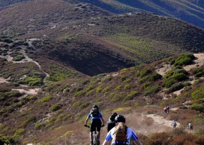 mountain bikers descending in Sardinia
