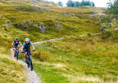 mountain bikers riding trail in lake district
