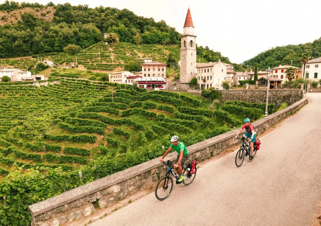 riding past vineyards in Italy